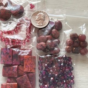 Assortment of fushia shades gemstone and glass beads